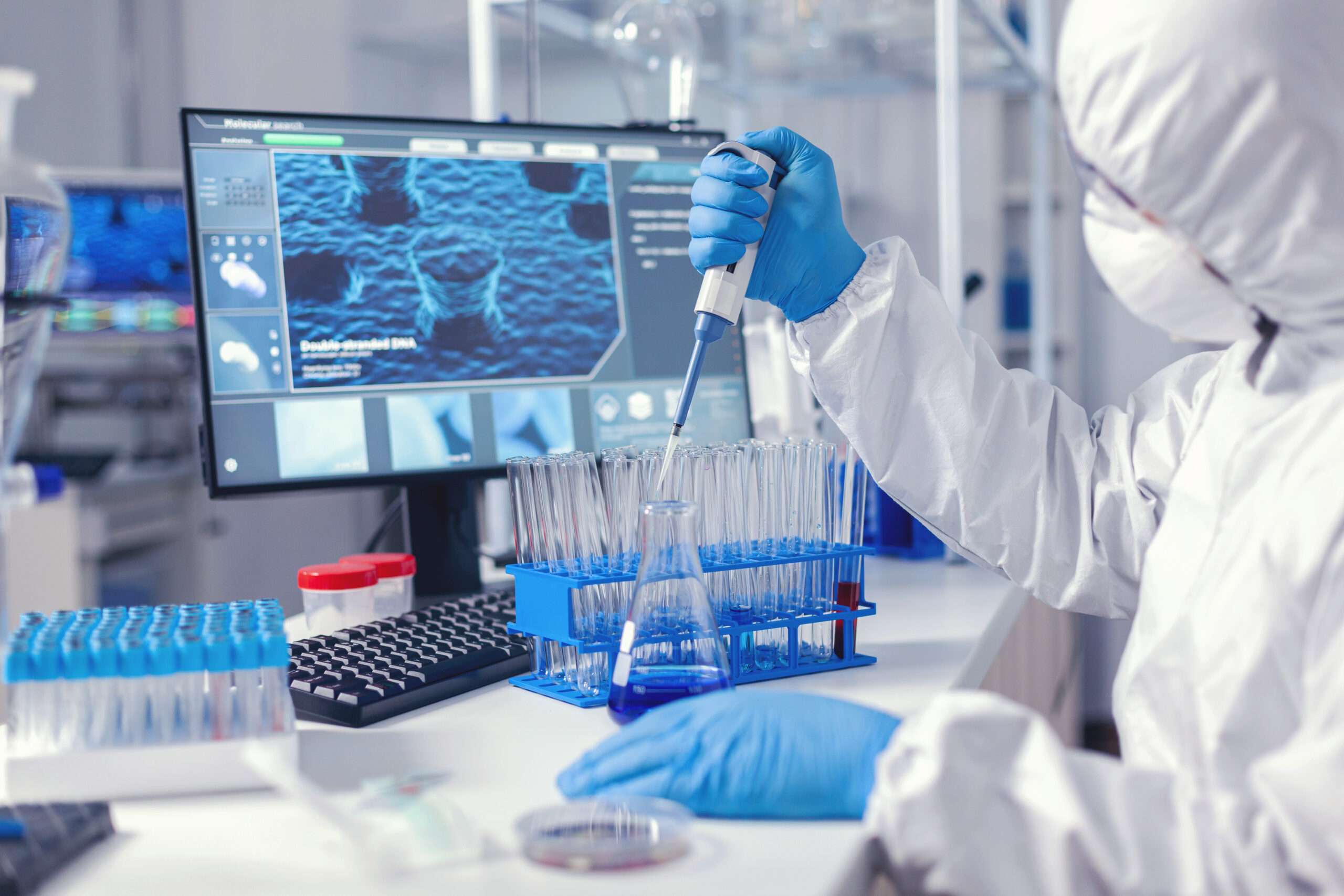 virolog coducting experiment course coronavirus pandemic with micropipette chemist modern laboratory doing research using dispenser during global epidemic with covid 19